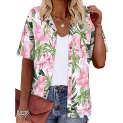 Women's hawaiian tropical shirt features vibrant colors, all-over island-inspired patterns, classic v-neck, and unique coconut shell buttons. Beautiful addition to your island wardrobe.